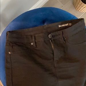 Knee length black denim skirt